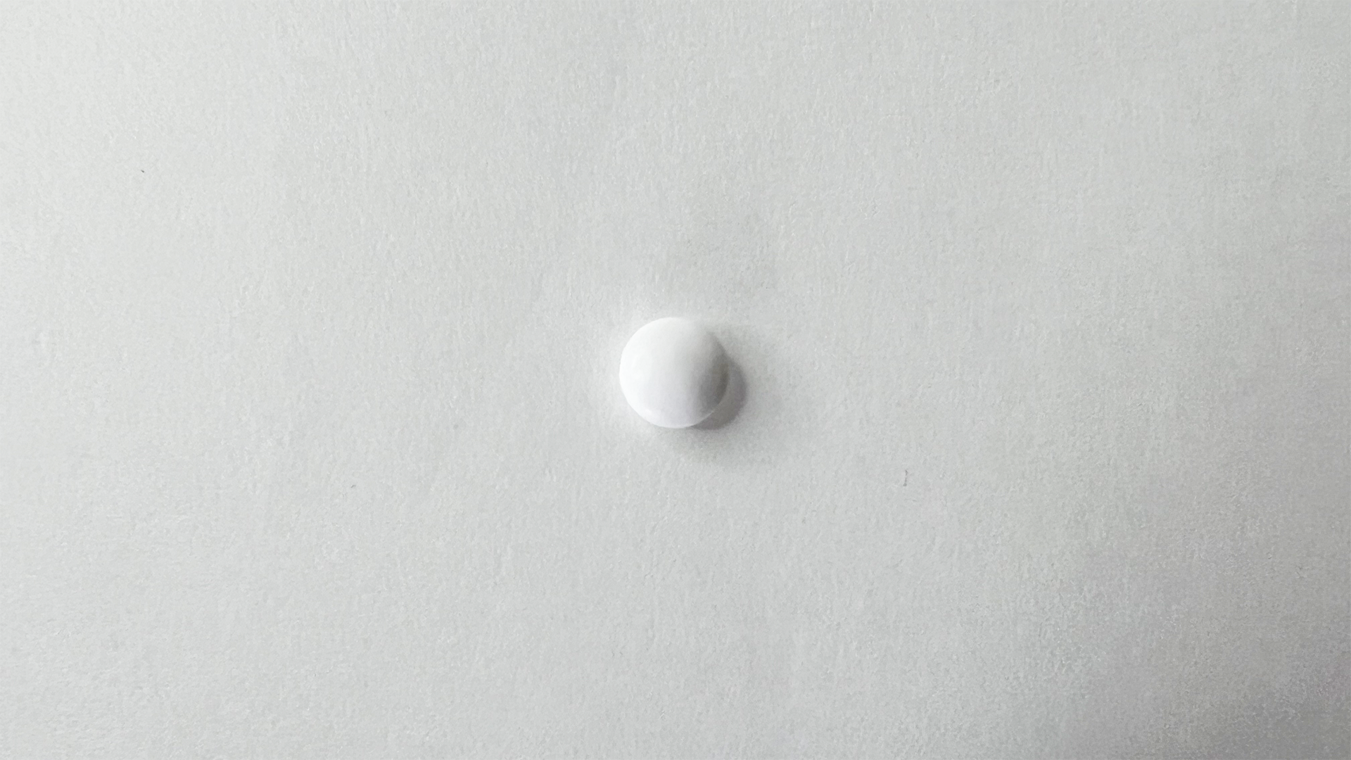 Restamin Kowa sugar-coated tablet — small white round tablet